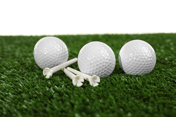 Golf set on grass isolated on white