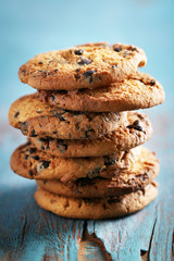 Close up focus view on cookies with chocolate crumbs on blue wooden table