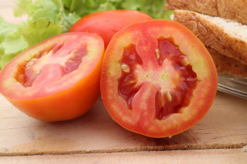 Healthy fresh vegetables salad preparation with kitchen utensils on a table and nutrition concepts