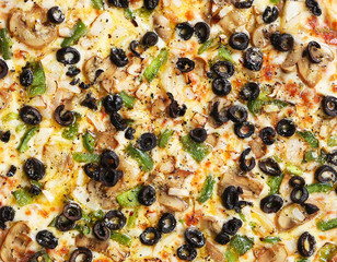 pizza with mushrooms black olives onions green pepper background