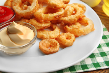 Chips rings with sauce on plate