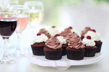 Tasting of wine and chocolate cupcakes, close up