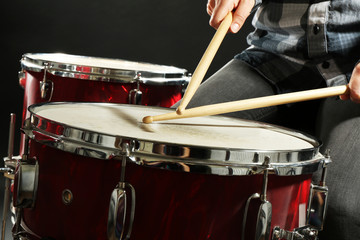 Fototapeta na wymiar Drummer playing the drums closeup