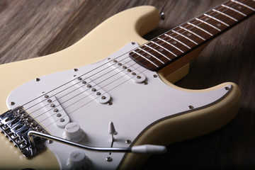 Obraz premium Electric guitar on wooden background, close up