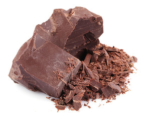 Dark chocolate pieces and shavings isolated on white