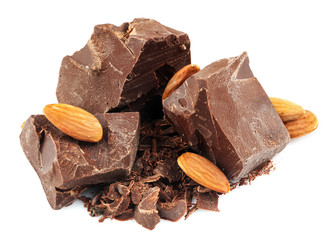 Dark chocolate pieces, shavings and almonds isolated on white