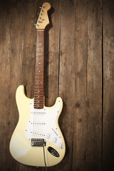 Obraz premium Electric guitar on wooden background