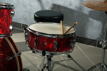 Drum set on brick wall background