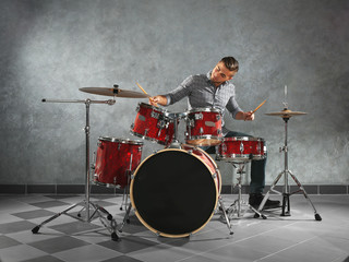 Musician playing the drums in a studio