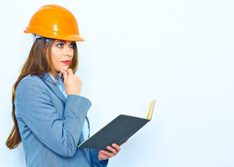 Young thinking business woman portrait.