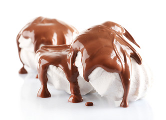 Chocolate poured on marshmallow isolated on white