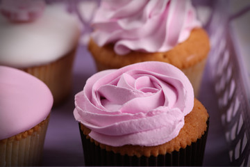 Tasty cupcakes on tray, close-up