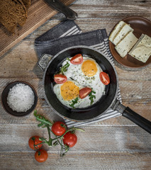 fried eggs in a frying pan top view