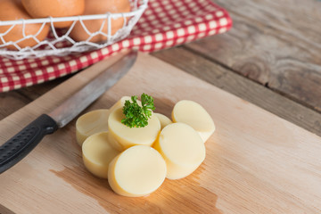 Sliced Egg Tofu on wood cutting board.