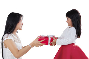 Sweet girl giving gift box on her mother