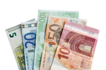 euro banknotes with different denomination and coins, isolated