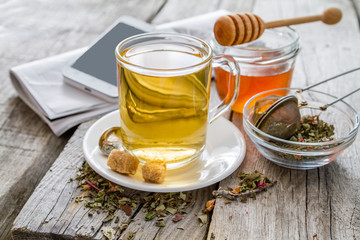 Herb tea in glass cup with honey