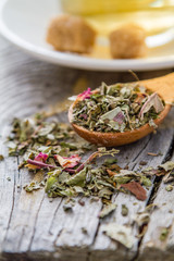 Fototapeta na wymiar Dry herb tea in wood spoon