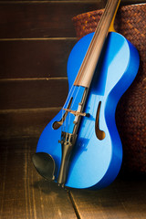 Modern violin on the wooden background. (Still Life Style)