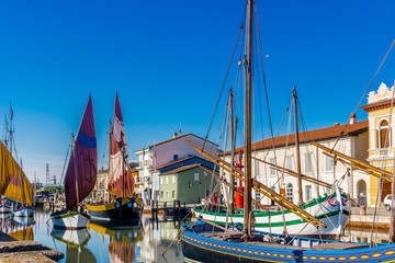 ancient sailboats on Italian Canal Port