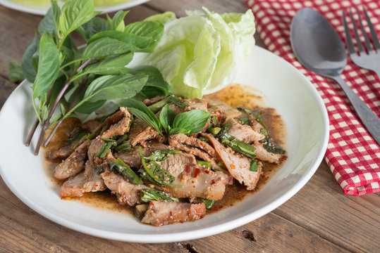 Sliced grilled pork spicy salad, Moo Nam Tok. Thai cuisine.