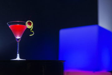 cherry martini cocktail drink at night in modern bar
