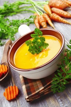 Carrots soup in the ceramic pot