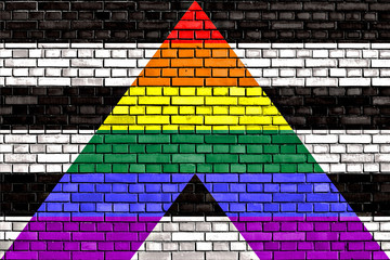 Straight Ally flag painted on brick wall