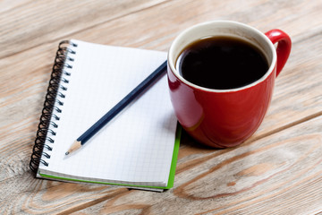 Coffee cup with notebook