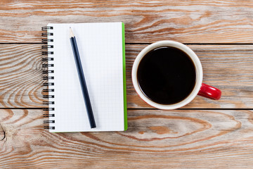 Coffee cup with notebook
