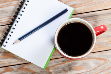 Coffee cup with notebook