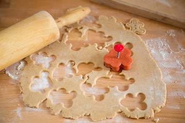Gingerbread preparations in kitchen, rolling pin and shape cutter
