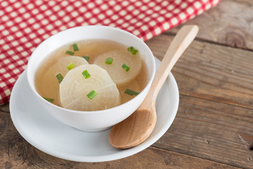 White radish soup in white bowl.