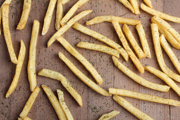 French fries in packing on a white table on a grey background