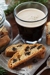 Coffee with biscotti or cantucci on wooden vintage table, traditional Italian biscuit or cookie