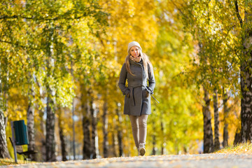 Young woman walking in autumn