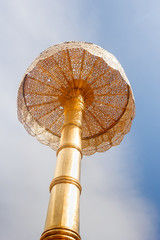 Gold religion umbrella with blue sky at Wat Phra That Doi Suthep temple in Chiangmai Thailand.