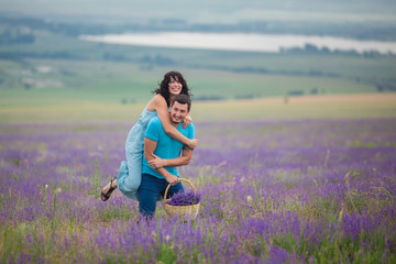Young couple harvesting lavender flowers