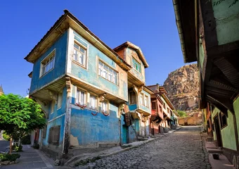 Rolgordijnen Old traditional ottoman house street with the Karahisar castle in Afyon, Turkey © Boris Stroujko