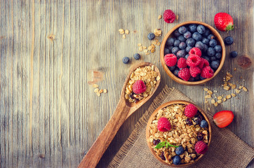 Fototapeta na wymiar Fresh healthy breakfast with granola and berries, copy space rus