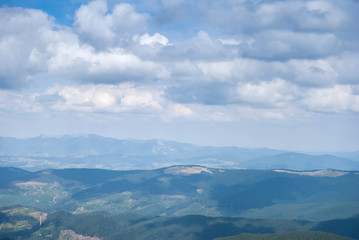 Fototapeta na wymiar View of misty mountains in summer Carpathians, Ukraine