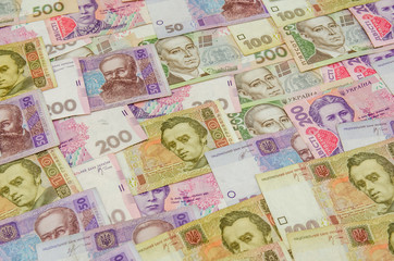 Fototapeta na wymiar different ukrainian banknotes background close-up