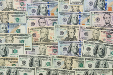 different usa dollars bills as background