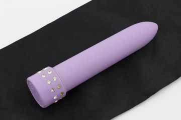 Sex Toy - Purple Vibrator on black silk
