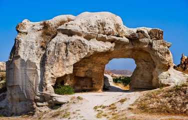 Bizarre hole in a rock formation in Cappadocia, famous tourist destination in Turkey