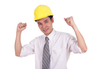 Happy young engineer celebrating with arm raised, concept of suc