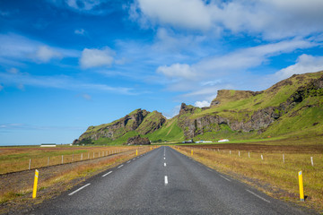 Straight asphalt road in the South coast of Iceland
