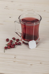 rose hip tea on wooden table