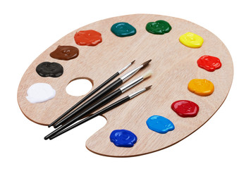 Wooden art palette with paints and brushes