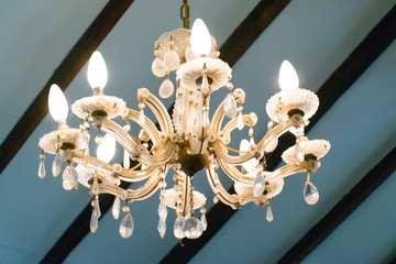 old style chandelier hanging from ceiling
